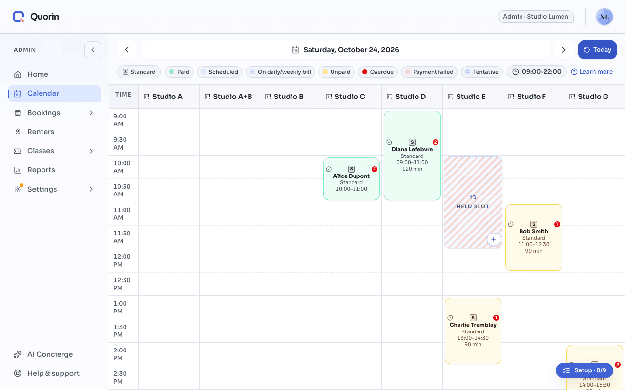 One day on the admin calendar: in the Studio E column, a hatched block labelled “Held slot”, from 10 a.m. to noon, next to ordinary bookings.